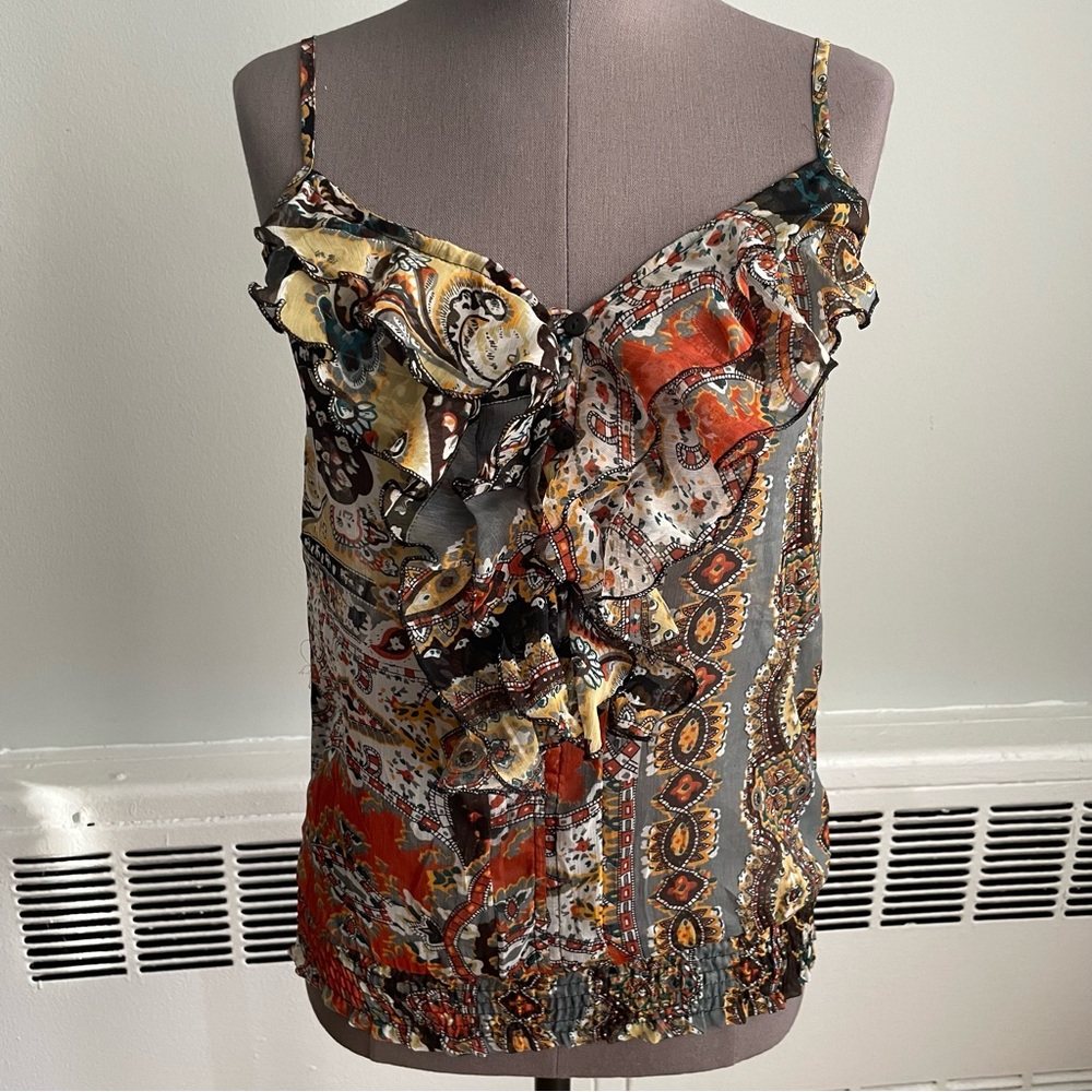 Spaghetti strap tank top with ruffled neckline and smocked waist